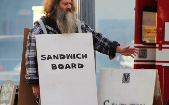 File photo
Halloween is coming, which means you’re soon sure to see creepy and clever costumes on Vashon Highway — such as this costume poking fun at the island’s proclivity for advertising events on sandwich boards.