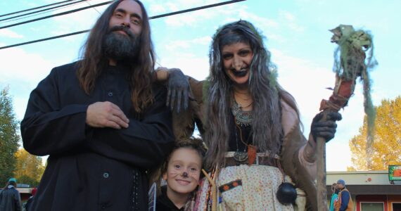 Grigori Rasputin, the Baba Yaga and a little one pose for a photo during Halloween 2023. (Alex Bruell photo)