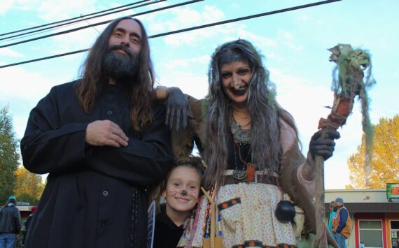 Grigori Rasputin, the Baba Yaga and a little one pose for a photo during Halloween 2023. (Alex Bruell photo)