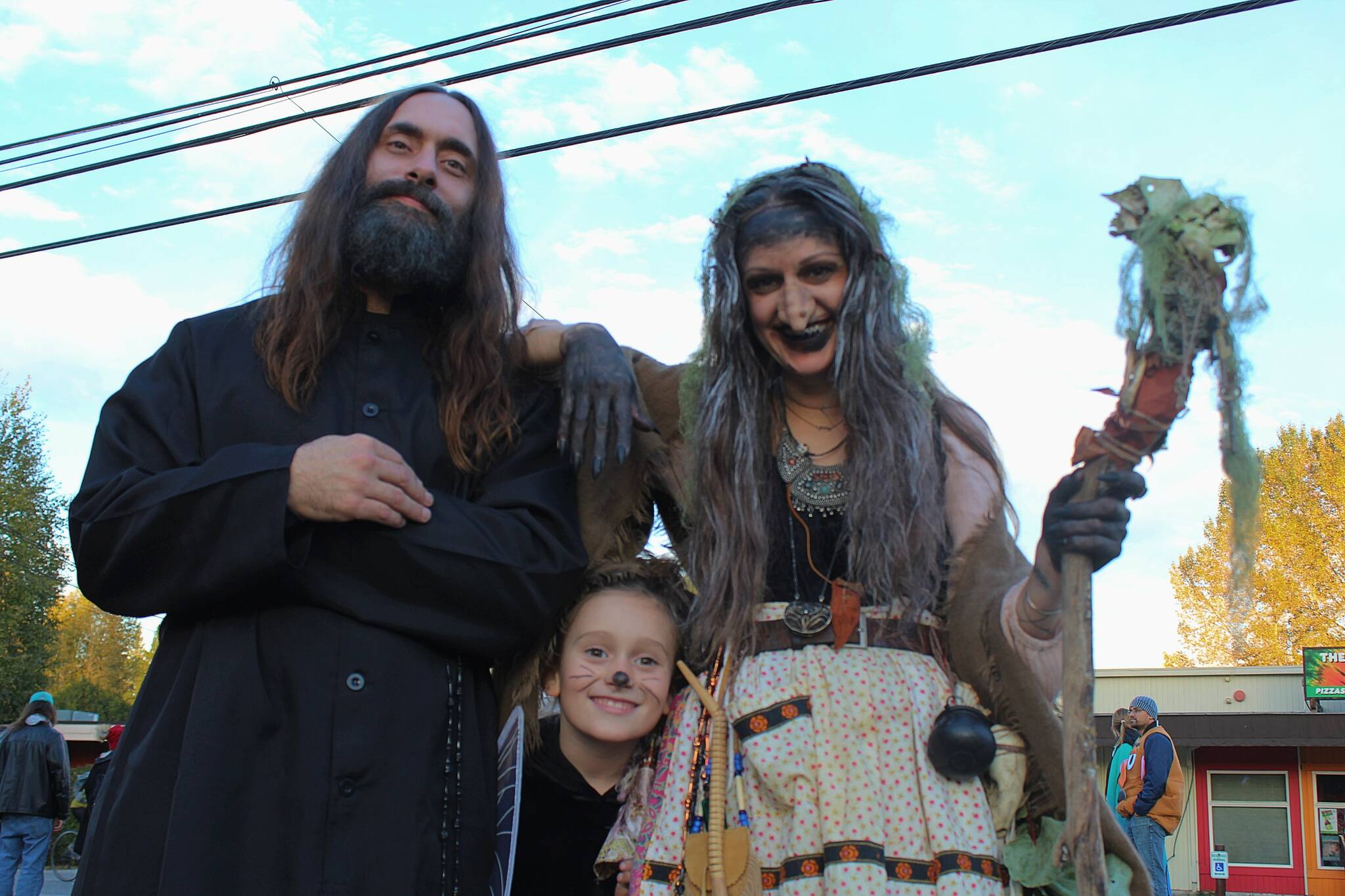 Grigori Rasputin, the Baba Yaga and a little one pose for a photo during Halloween 2023. (Alex Bruell photo)