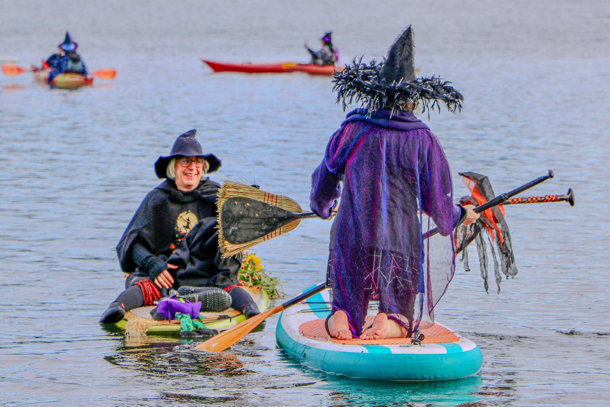 Jensen Point transforms into a spectacle of pointed hats and flowing capes as Vashon’s witches take to the water for their annual paddle. (Aspen Anderson photo)