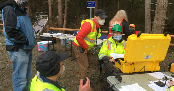 Courtesy photo
This ham radio team set up to support a command post staffed by members of the Community Emergency Response Team (CERT). They are using one of the group’s portable communications caches (PCCs, in the yellow waterproof case) that has been packed with a range of radio communications capabilities, including email over ham radio using software called Winlink.