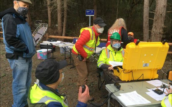 Courtesy photo
This ham radio team set up to support a command post staffed by members of the Community Emergency Response Team (CERT). They are using one of the group’s portable communications caches (PCCs, in the yellow waterproof case) that has been packed with a range of radio communications capabilities, including email over ham radio using software called Winlink.