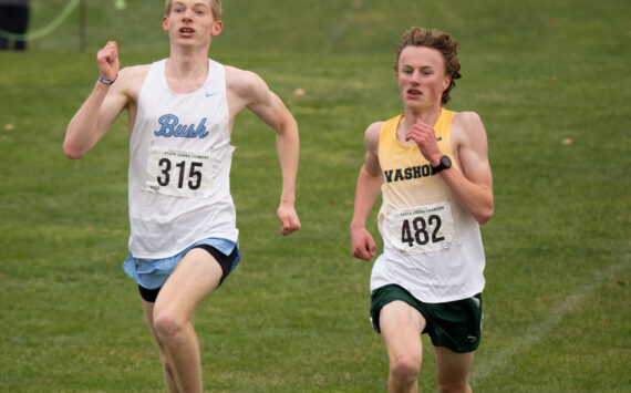 John Decker photo
Duncan Frisbie-Smith of the Bush School slugs it out with Vashon's Josh Healey in a dramatic photo-finish for second place at the Washington State Championships at Sun Willows Golf Course in Pasco, WA on Saturday, November 9, 2024.