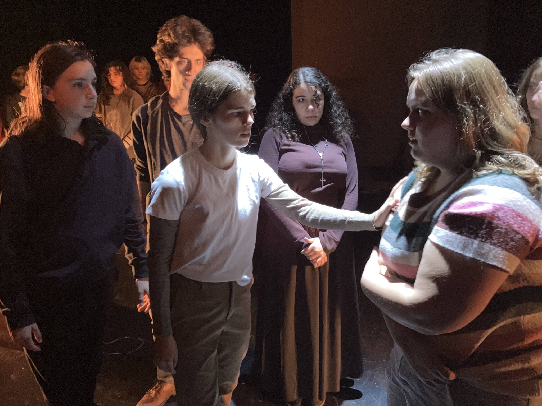 Ella Saffery (center, in white shirt) and Lidia Bojko (right) recreate a nightmare with the help of the rest of the cast of “The Trap,” opening this weekend at Vashon High School. (Courtesy photo)