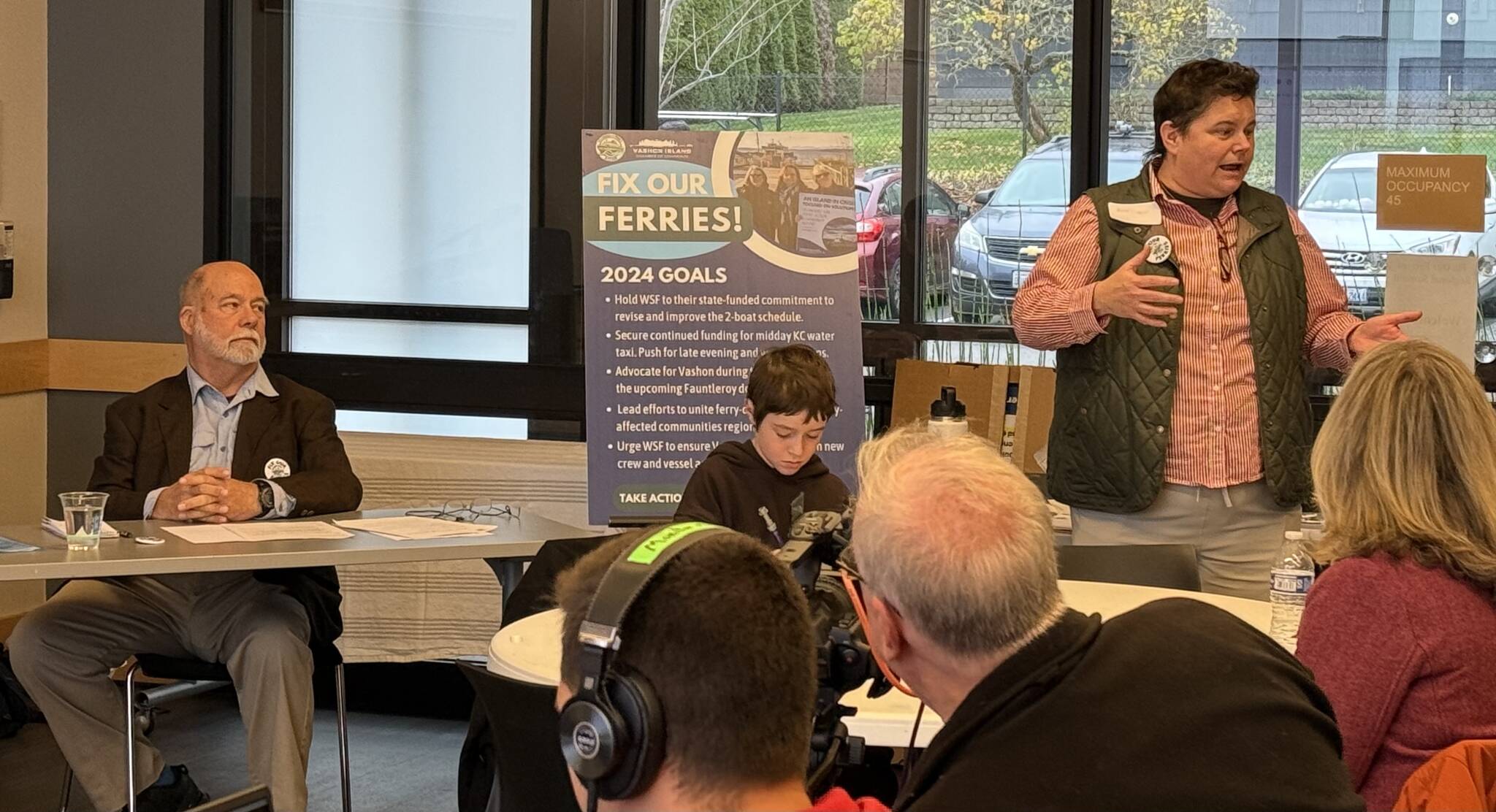 Courtesy photo
Islanders for Ferry Action Director Amy Drayer welcomes participants to the Regional Ferry Summit as Rick Wallace prepares to moderate the first panel discussion.