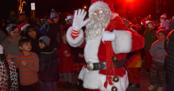 Santa waves to the camera on Vashon Highway SW. Jim Diers photo