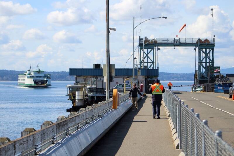 A ferry pulls toward the Fauntleroy ferry dock on a cloud-pocked March afternoon. (Alex Bruell photo)