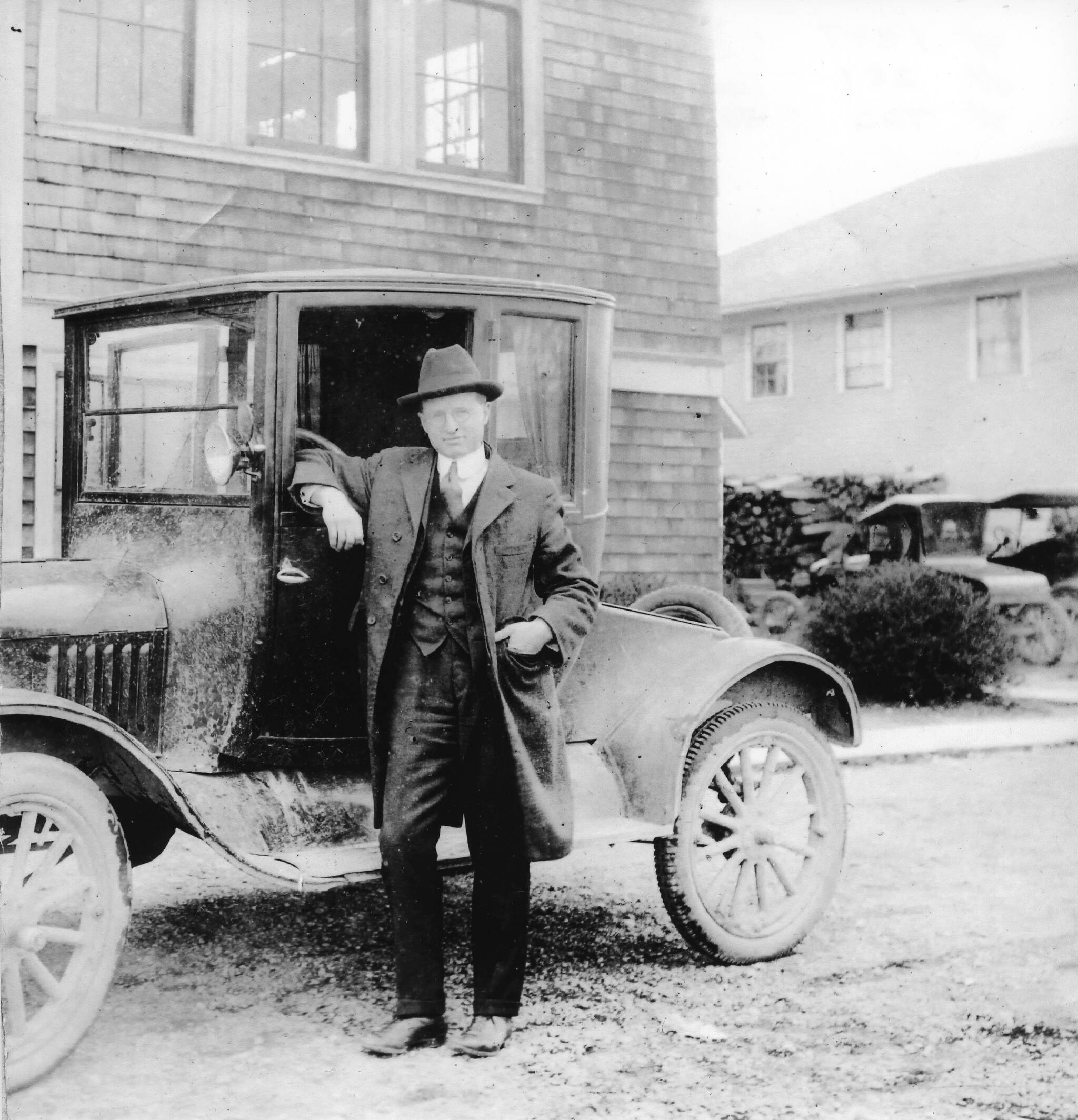 Photograph courtesy of the Vashon Heritage Museum
Dr. Fredrick McMurray, with his trusty Model T Ford Coupe.