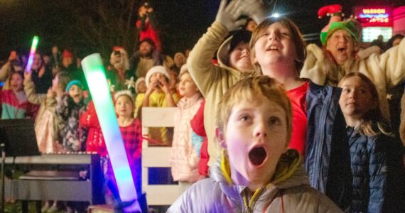 Alex Bruell photo
Kids and adults react as the great tree lights up next to the Vashon Presbyterian Church.