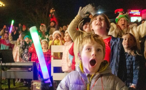 Alex Bruell photo
Kids and adults react as the great tree lights up next to the Vashon Presbyterian Church.