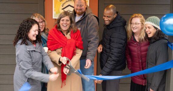 The ribbon is cut at Island Center Homes by, from left to right: Kelly Rider, director of the King County Department of Community and Human Services; Judy Tucker, owner of Form + Function Architecture; Kari Dohn Decker, interim executive director of Vashon HouseHold; Alex Crowder, CEO of Crowder Construction; Chris Lovings, community engagement lead at the Washington State Department of Commerce; Rachel Hetrick, housing stewardship manager at Vashon HouseHold; and Shelly Whitlock, property manager at Vashon HouseHold.
(John Decker photo)