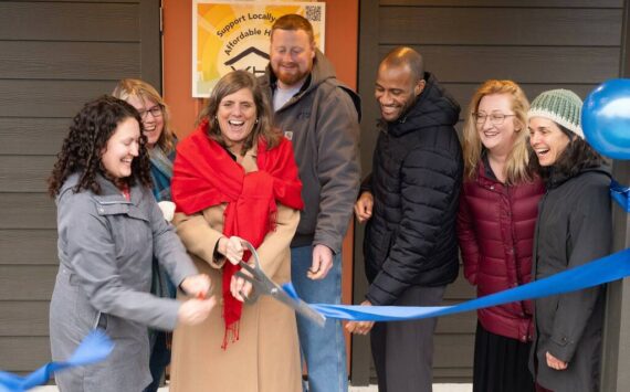 The ribbon is cut at Island Center Homes by, from left to right: Kelly Rider, director of the King County Department of Community and Human Services; Judy Tucker, owner of Form + Function Architecture; Kari Dohn Decker, interim executive director of Vashon HouseHold; Alex Crowder, CEO of Crowder Construction; Chris Lovings, community engagement lead at the Washington State Department of Commerce; Rachel Hetrick, housing stewardship manager at Vashon HouseHold; and Shelly Whitlock, property manager at Vashon HouseHold.
(John Decker photo)