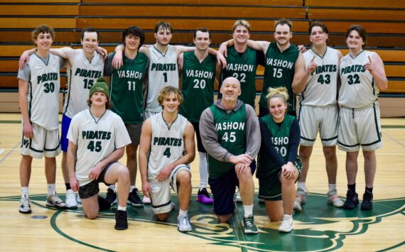 Pam Stenerson photo 
The annual Vashon High School alumni basketball game took place on Saturday, Jan. 4 at the high school. Organized by class of 2023 graduate Ben Larson, the exciting game came down to the last shot with a 72-71 victory for the white team. The players in this picture are (Back row, L-R) Finn Hawkins ‘24, Elias Weston ‘10, Reid Stromberg ‘24, Rhys Carlton ‘23, Jessie Norton ‘15, Sam Walker ‘22, Colin Pottinger ‘19, Sawyer Ranney ‘24, Alec Pottinger ‘23, and front (row) Will Weber ‘23, Ben Larson, Caleb Smith 1995, Lola Kuyper ‘22.