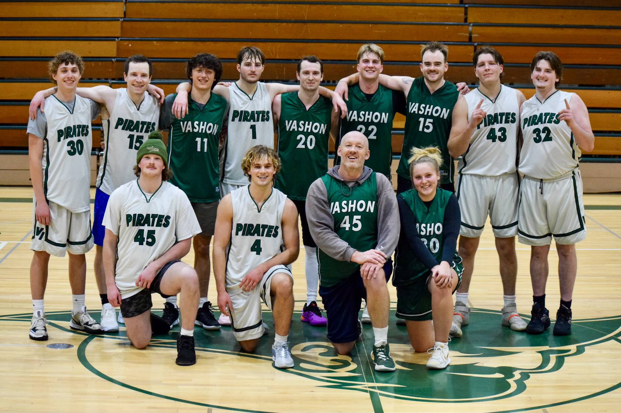 Pam Stenerson photo 
The annual Vashon High School alumni basketball game took place on Saturday, Jan. 4 at the high school. Organized by class of 2023 graduate Ben Larson, the exciting game came down to the last shot with a 72-71 victory for the white team. The players in this picture are (Back row, L-R) Finn Hawkins ‘24, Elias Weston ‘10, Reid Stromberg ‘24, Rhys Carlton ‘23, Jessie Norton ‘15, Sam Walker ‘22, Colin Pottinger ‘19, Sawyer Ranney ‘24, Alec Pottinger ‘23, and front (row) Will Weber ‘23, Ben Larson, Caleb Smith 1995, Lola Kuyper ‘22.